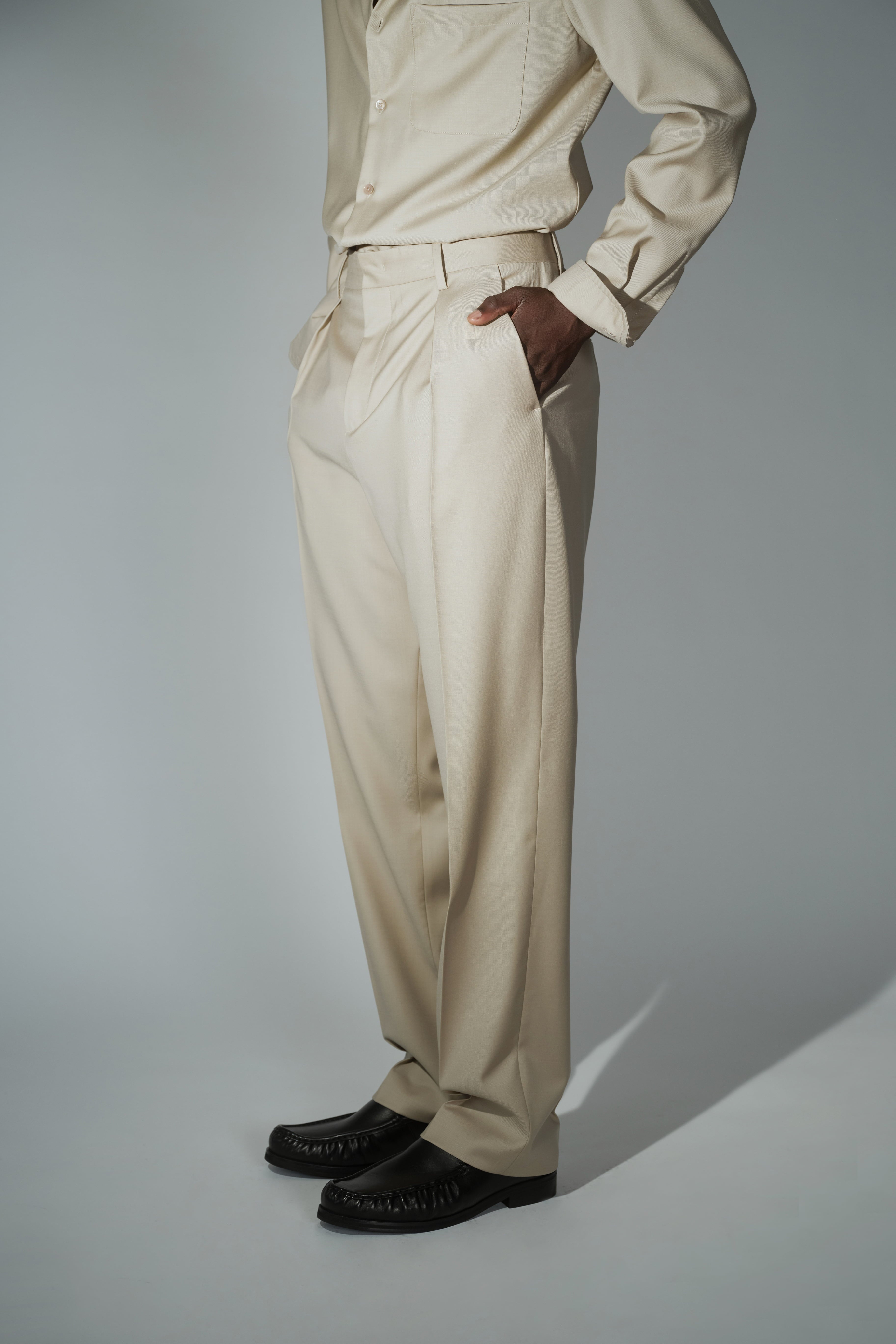Side view of RÆR STUDIOS x Kevin Lutolf pleated trousers in sage