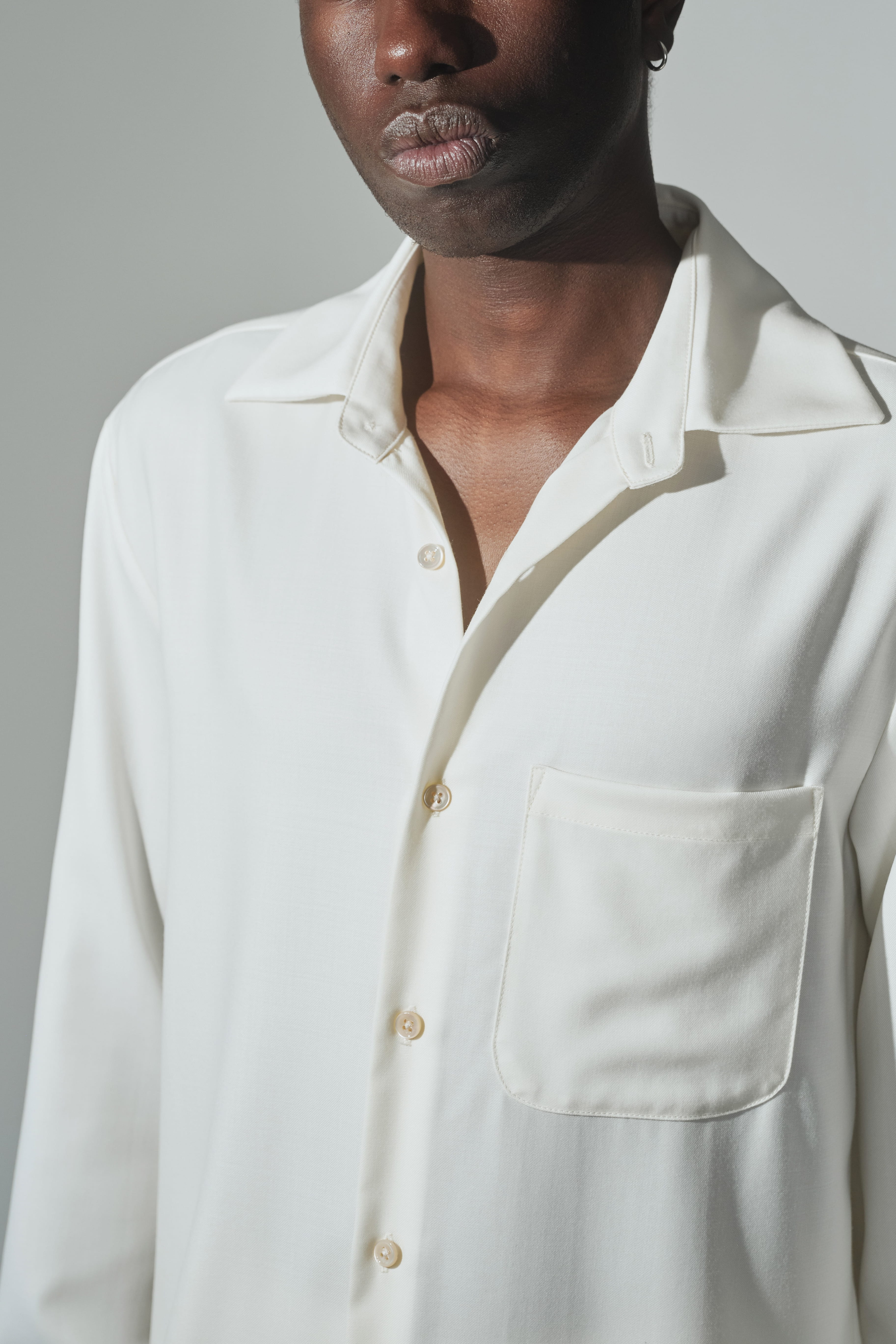 Close-up of RÆR STUDIOS x Kevin Lutolf shirt in off-white