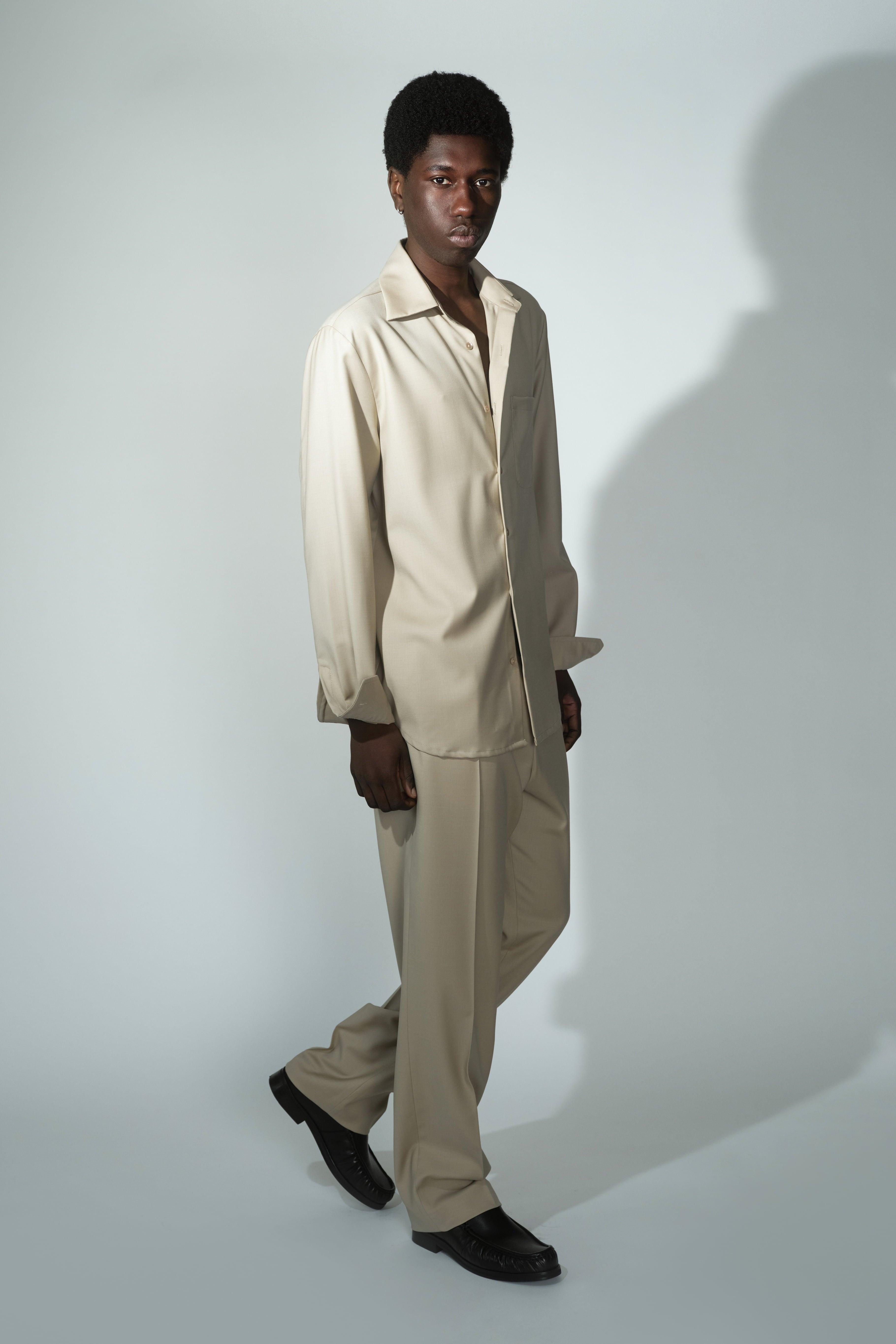 Complete look of RÆR STUDIOS x Kevin Lutolf pleated trousers in sage