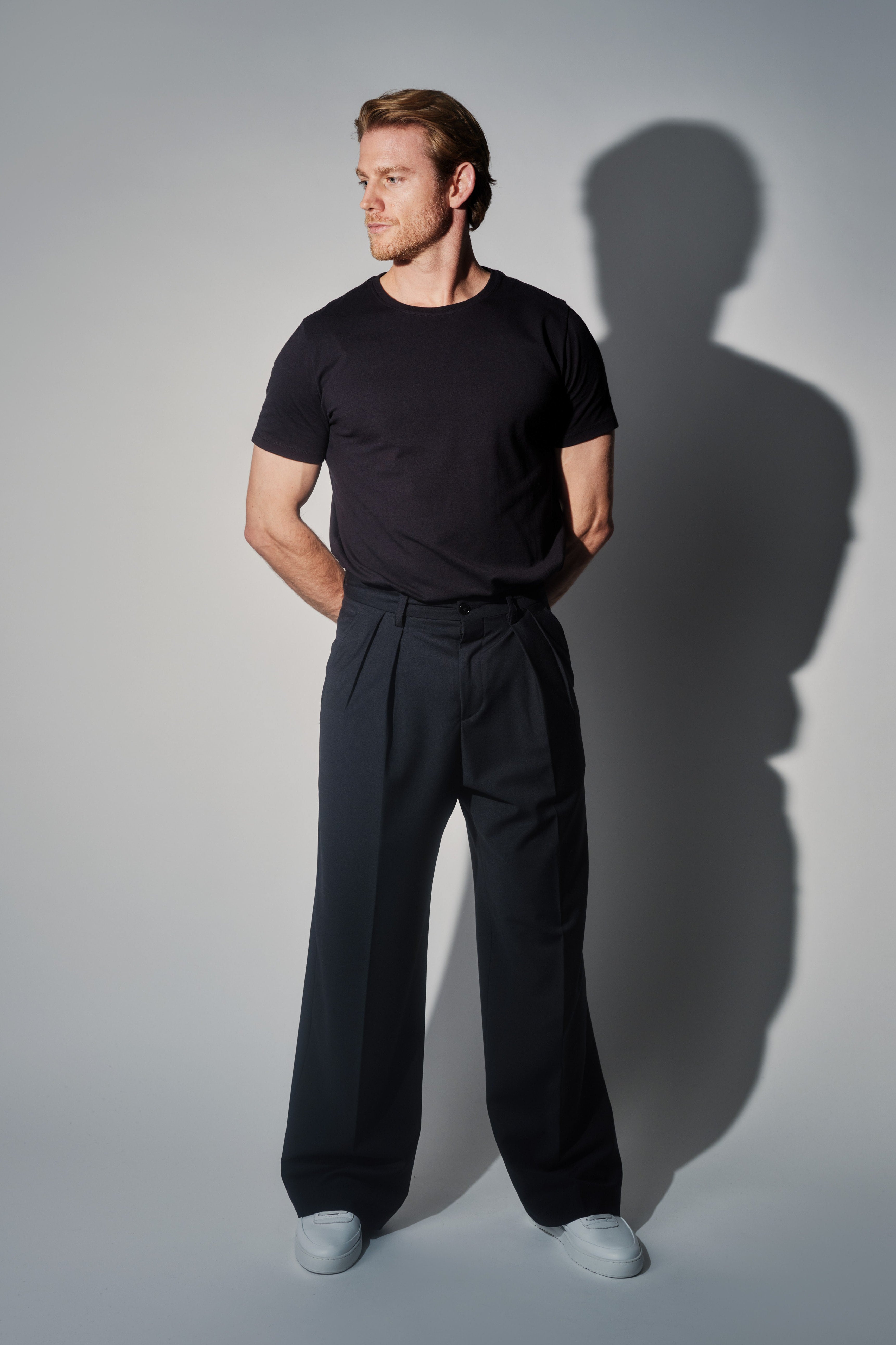 RÆR | RAER Pleated Wool Wide-Leg Trousers – Black