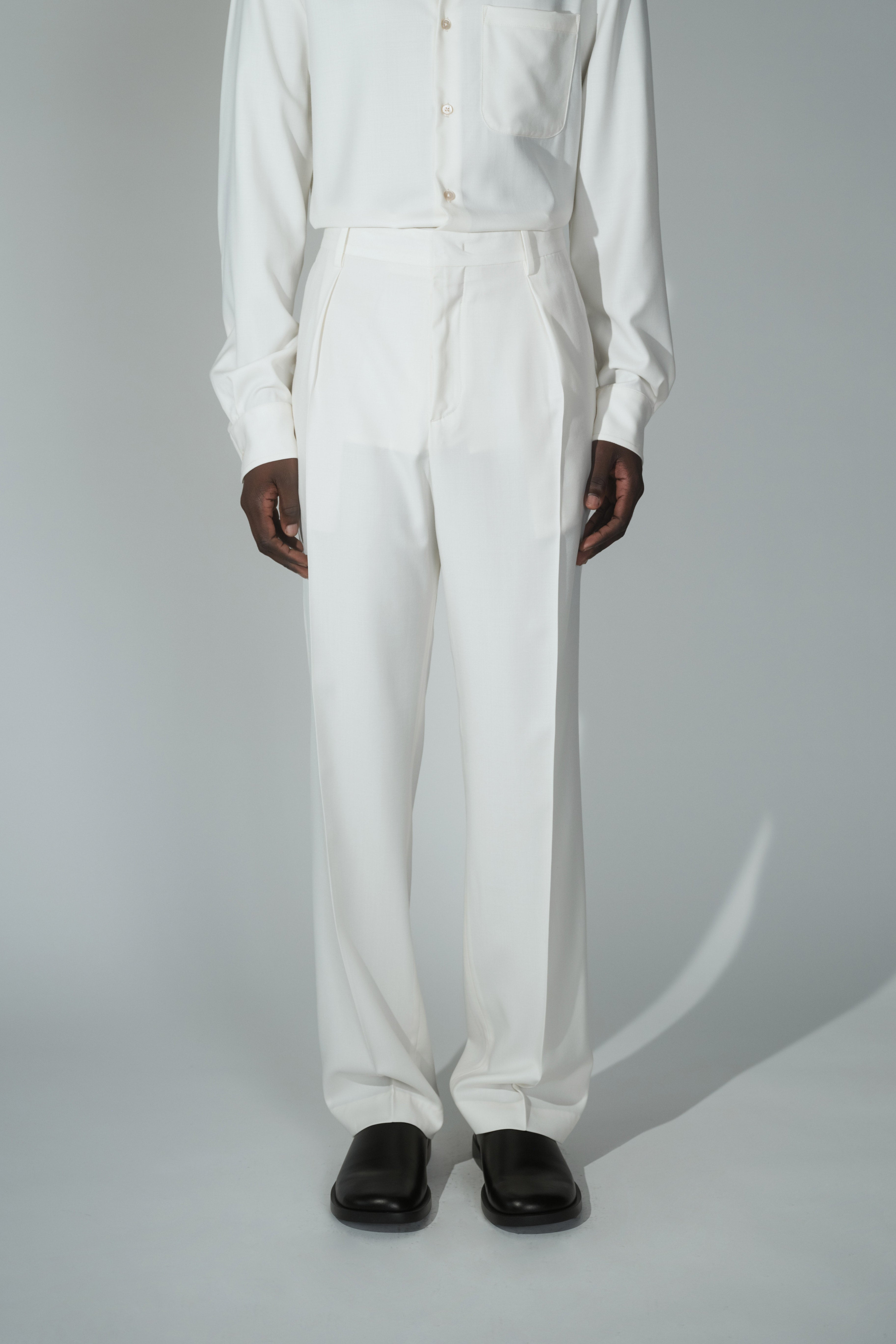 RÆR STUDIOS x Kevin Lutolf pleated trousers in off-white