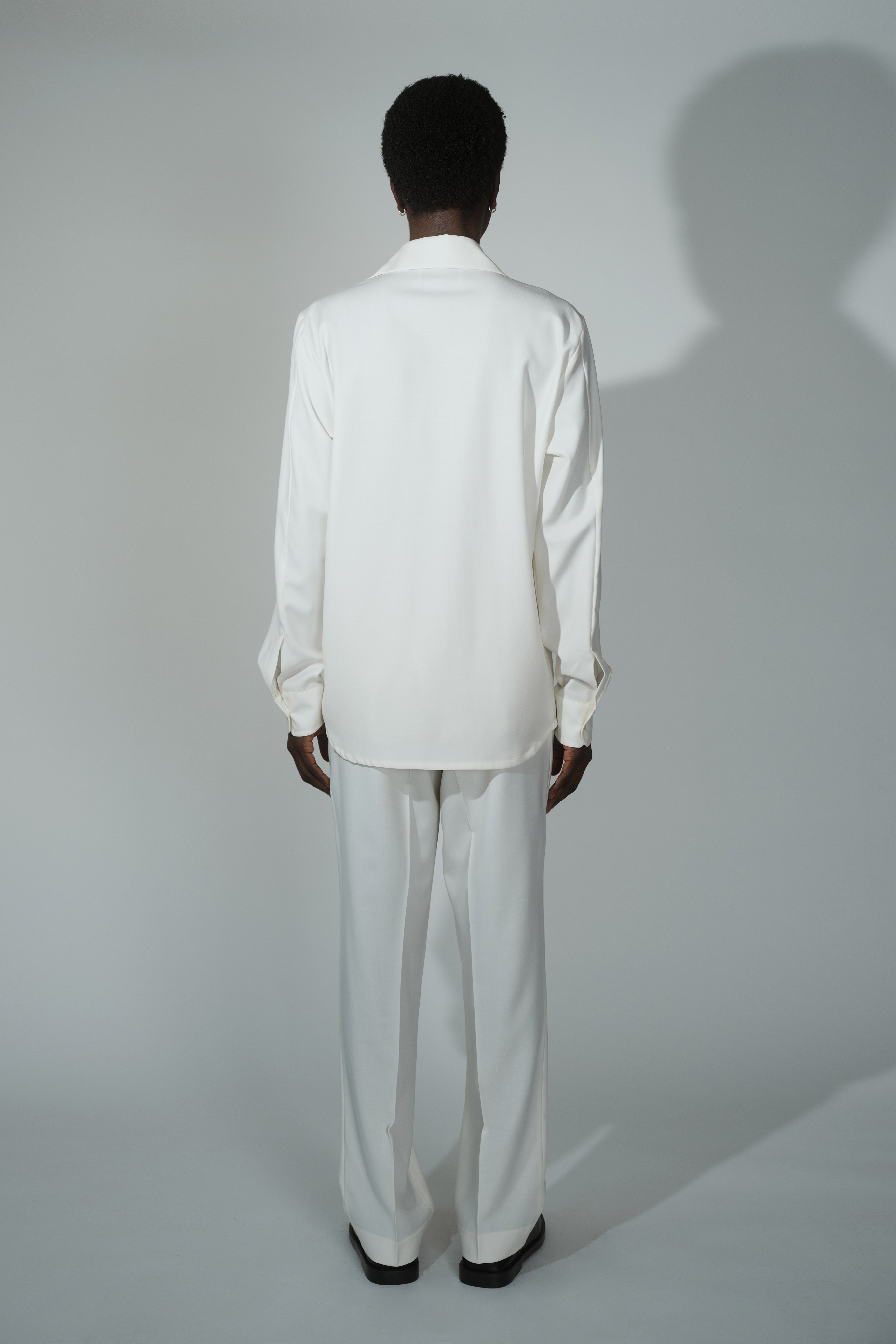 Back view of RÆR STUDIOS x Kevin Lutolf shirt in off-white