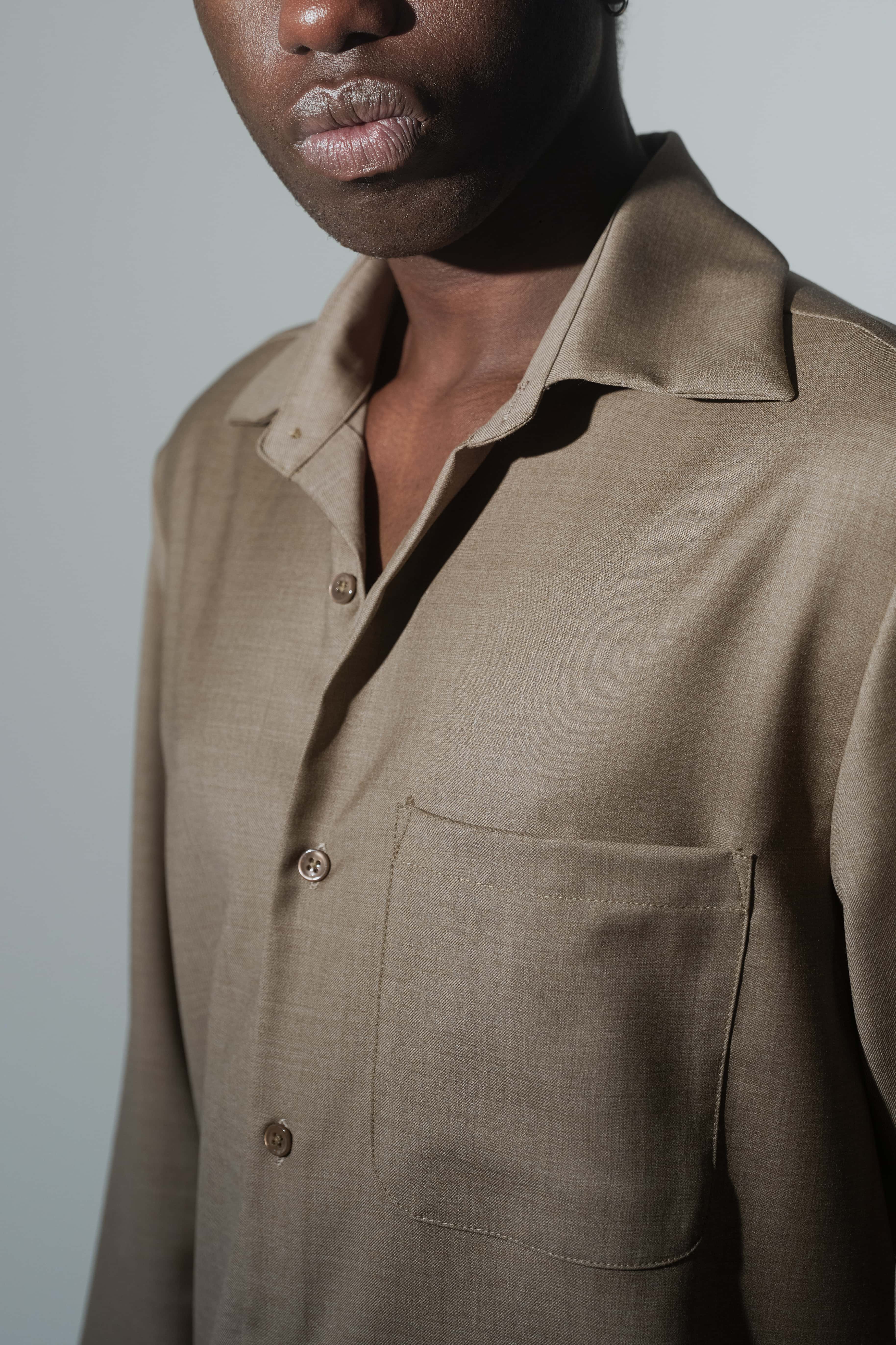 Close-up of RÆR STUDIOS x Kevin Lutolf shirt in olive